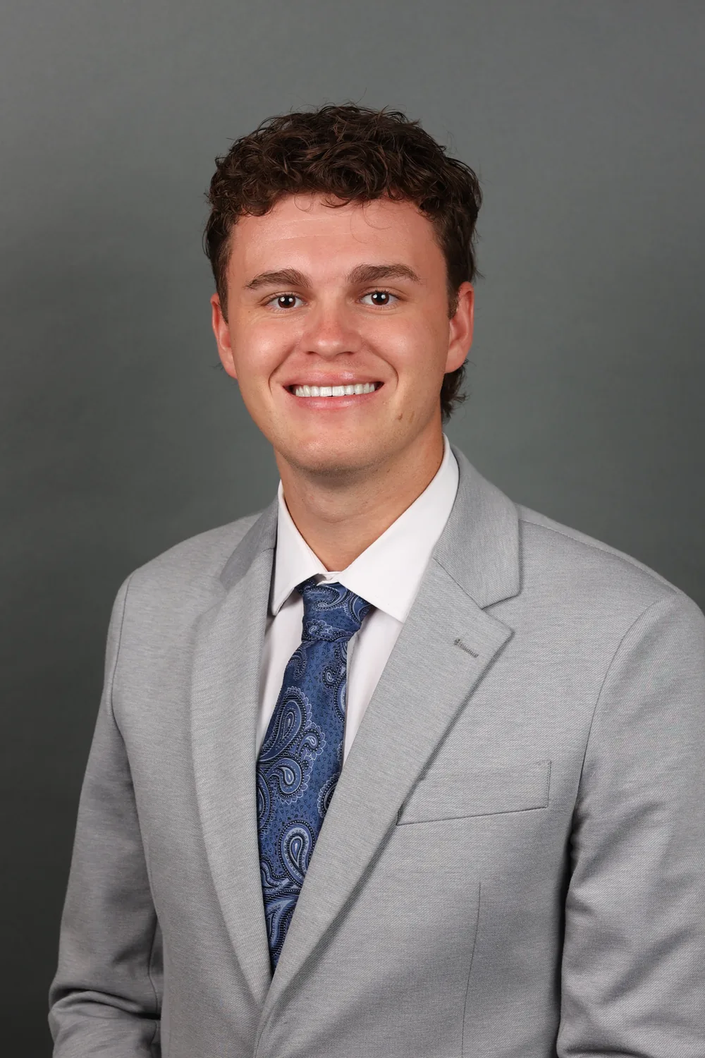 Professional headshot of Lot Holmstead.